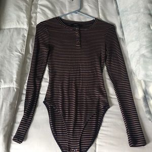 Two long sleeve body suits. Both women’s small!